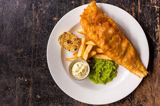 Fish and chips with tartare sauce and pea purée